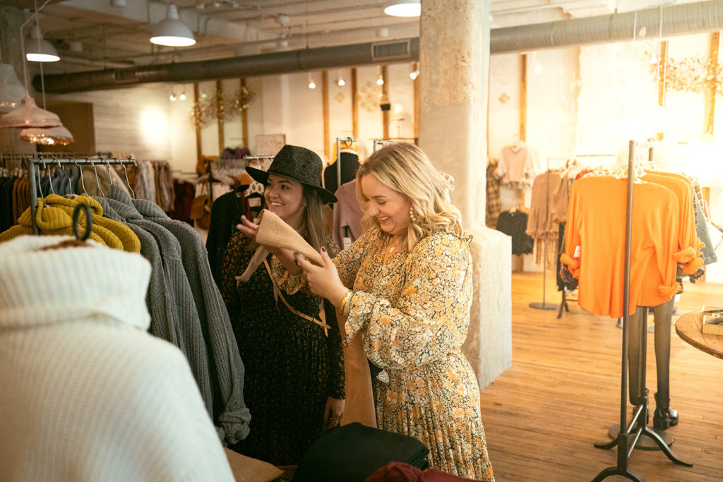 Shopping online during Quarantine - SELL EAT LOVE.

Two woman shopping in store, smiling. 