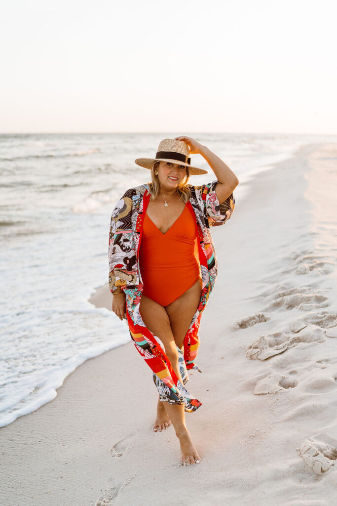 5 Ways to Style a Kimono - Woman standing on beach wearing Amazon one piece bathing suit with Kimono from Amazon