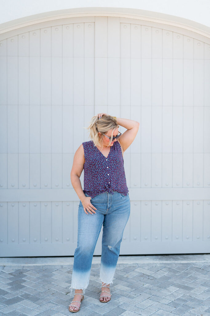 What to Wear 4th of July - Dainty red, white and blue star covered v-neck sleeveless shirts with denim jeans