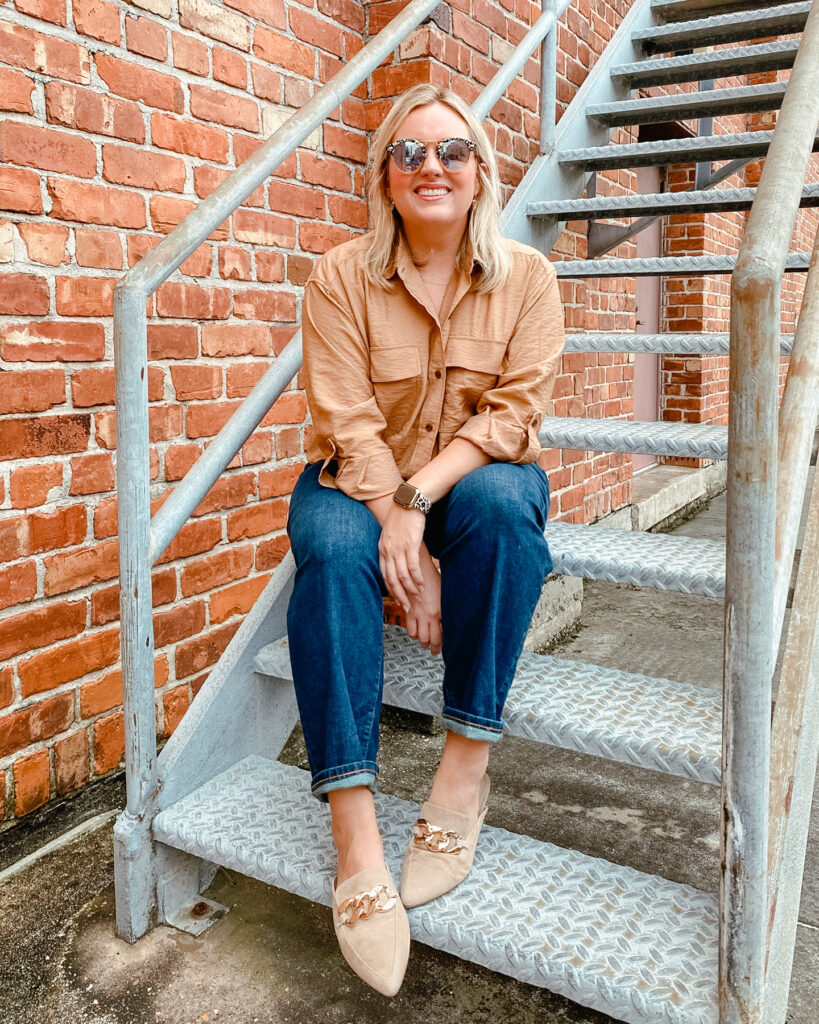 Woman sitting wearing long sleeve button up utility shirt with denim jeans from Banana Republic Fall Styles. SellEatLove.com 