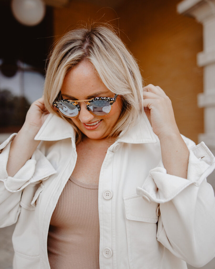 5 Trends to Try This Fall | Sell Eat Love. Woman smiling, wearing Neutral Shacket, collar up, with neutral ribbed tank 