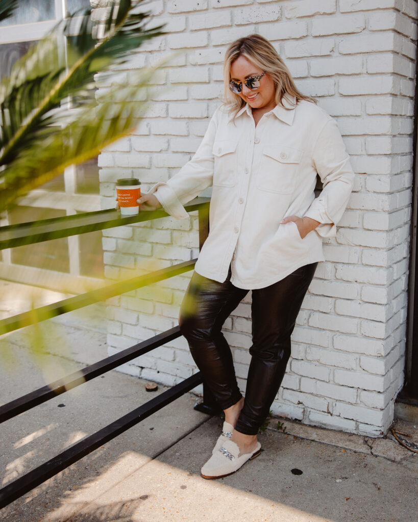 5 Trends to Try This Fall | Sell Eat Love. Wearing Neutral Shacket and Faux Leather Spanx Leggings, holding a coffee
