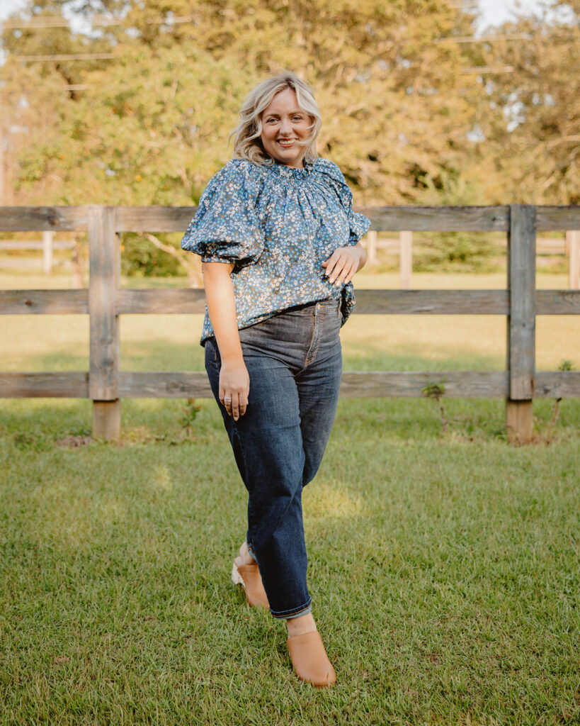 5 Trends to Try This Fall | Sell Eat Love - Woman outside wearing peasant top, dark denim jeans and clogs.