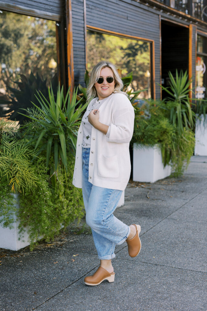 5 Trends to Try This Fall | Sell Eat Love - Woman outside wearing star tee, cardigan, boyfriend jeans and clogs